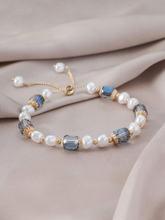 Elegant adjustable bracelet with freshwater pearls, blue crystals and gold-plated accents - luxury designer jewellery for UK customers