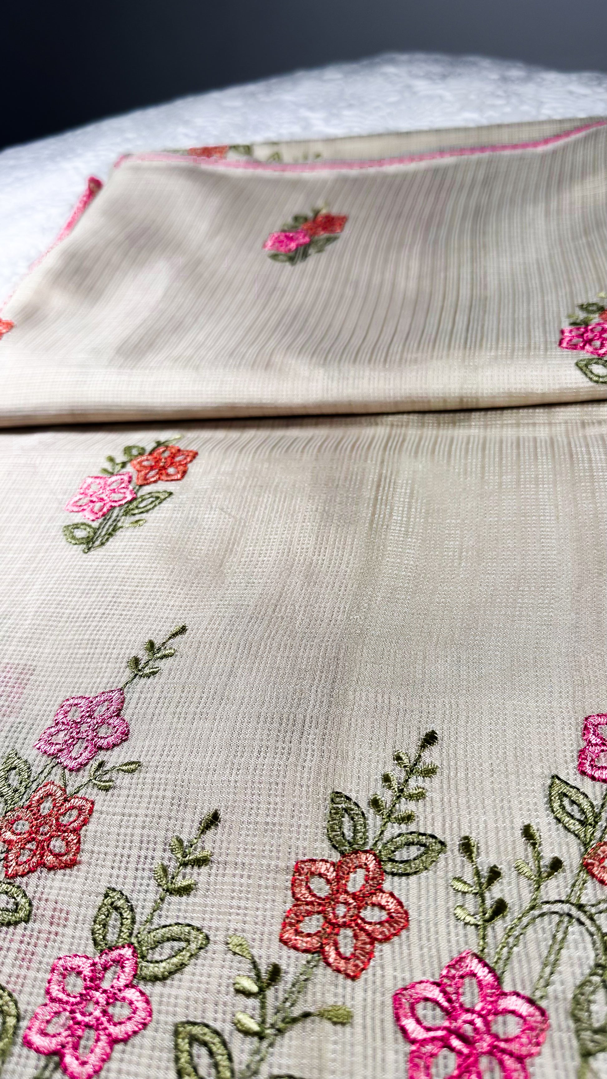 Hand-embroidered linen table runner and napkins set featuring delicate pink and coral floral motifs with green leaves and burgundy trim - traditional cross-stitch needlework for UK home decor