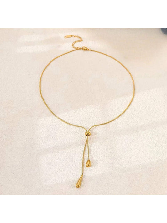 Minimalist gold chain necklace with adjustable teardrop pendant detail - delicate contemporary designer jewellery for UK customers